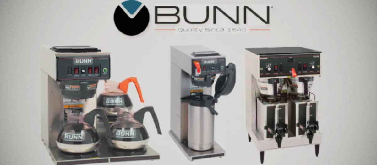Bunn Coffee Makers displayed in a commercial setup featuring multiple models with carafes and thermal dispensers.