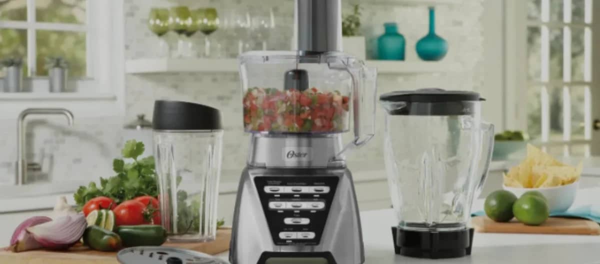 Blenders with multiple jars and fresh ingredients on a modern kitchen counter