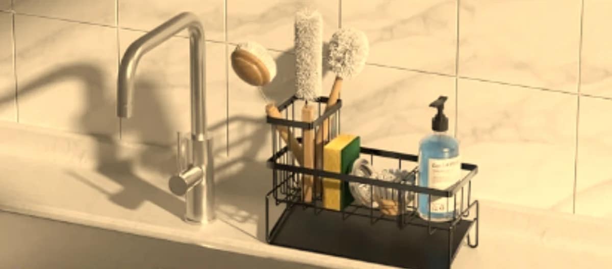 Sponge Holder for kitchen sinks featuring a black metal organizer with dish brushes, sponges, and a soap dispenser placed beside a modern stainless steel faucet.